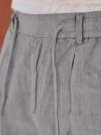 NICHOLS | PANTALONI LARGHI IN LINO CON CORDINO