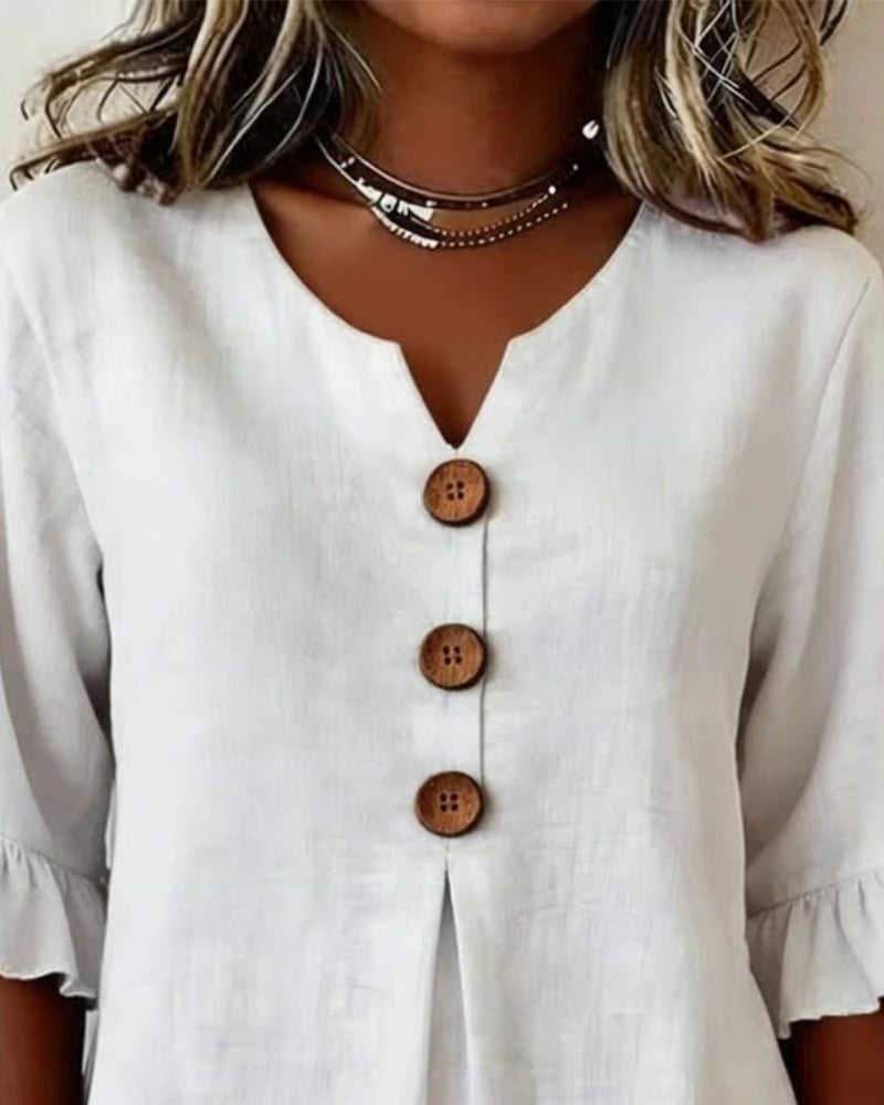 Sophie | Blusa bottonata con volant