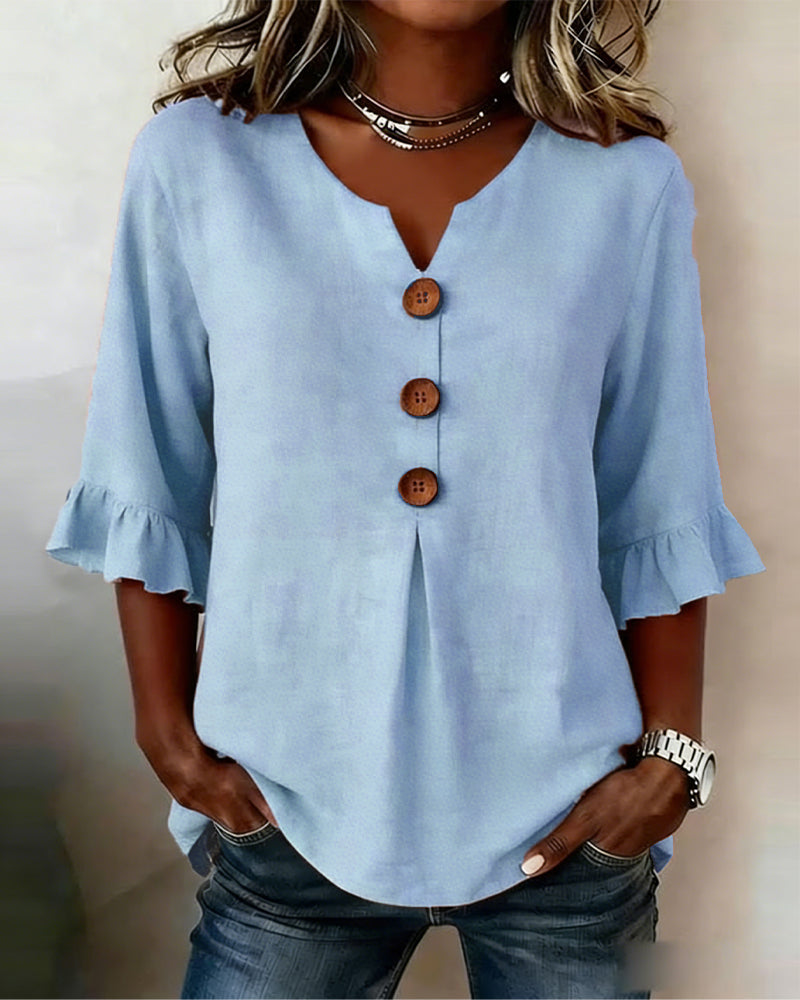 Sophie | Blusa bottonata con volant