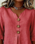 Sophie | Blusa bottonata con volant