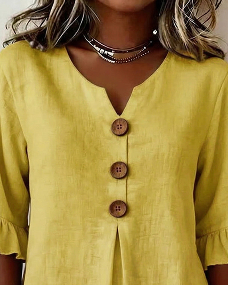 Sophie | Blusa bottonata con volant