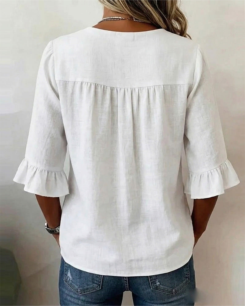 Sophie | Blusa bottonata con volant