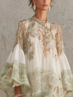 Solange | Abito corto asimmetrico in chiffon verde con volant e maniche a campana