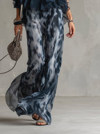 Chloé | Completo elegante con top blu navy e pantaloni larghi stampati