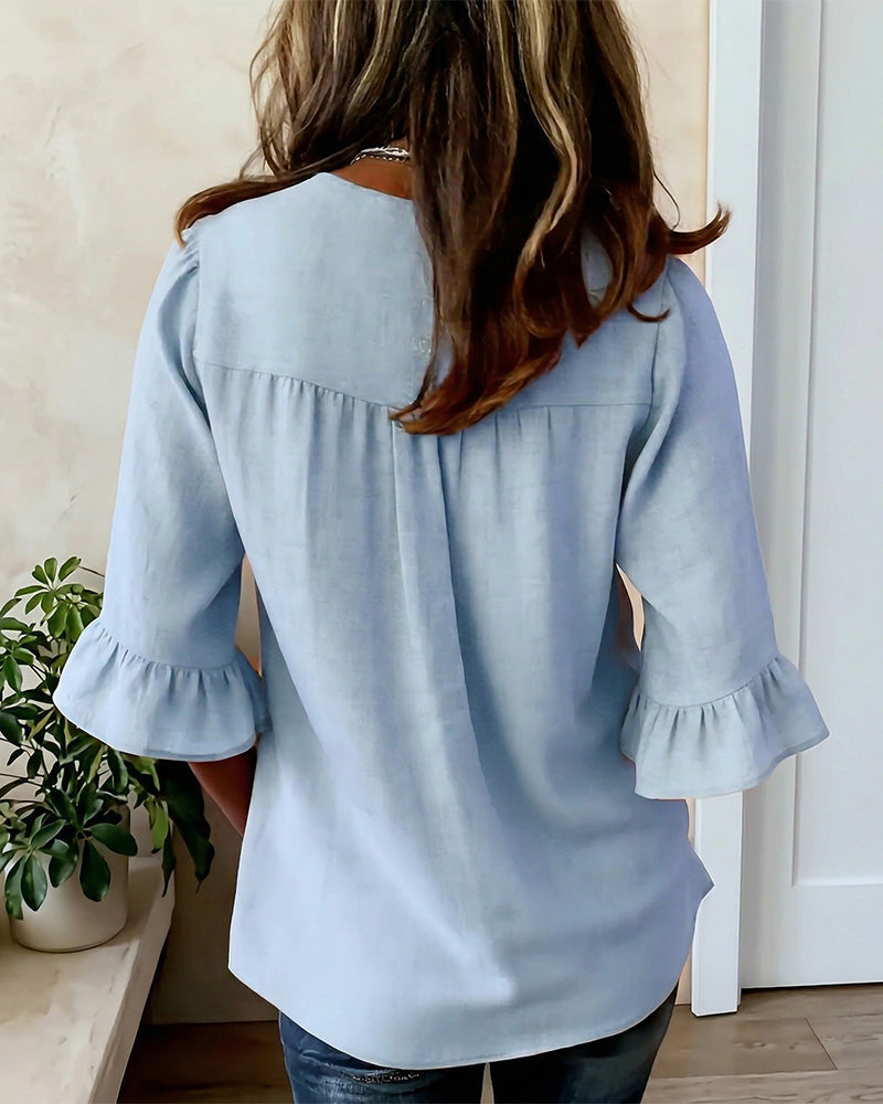 Sophie | Blusa bottonata con volant